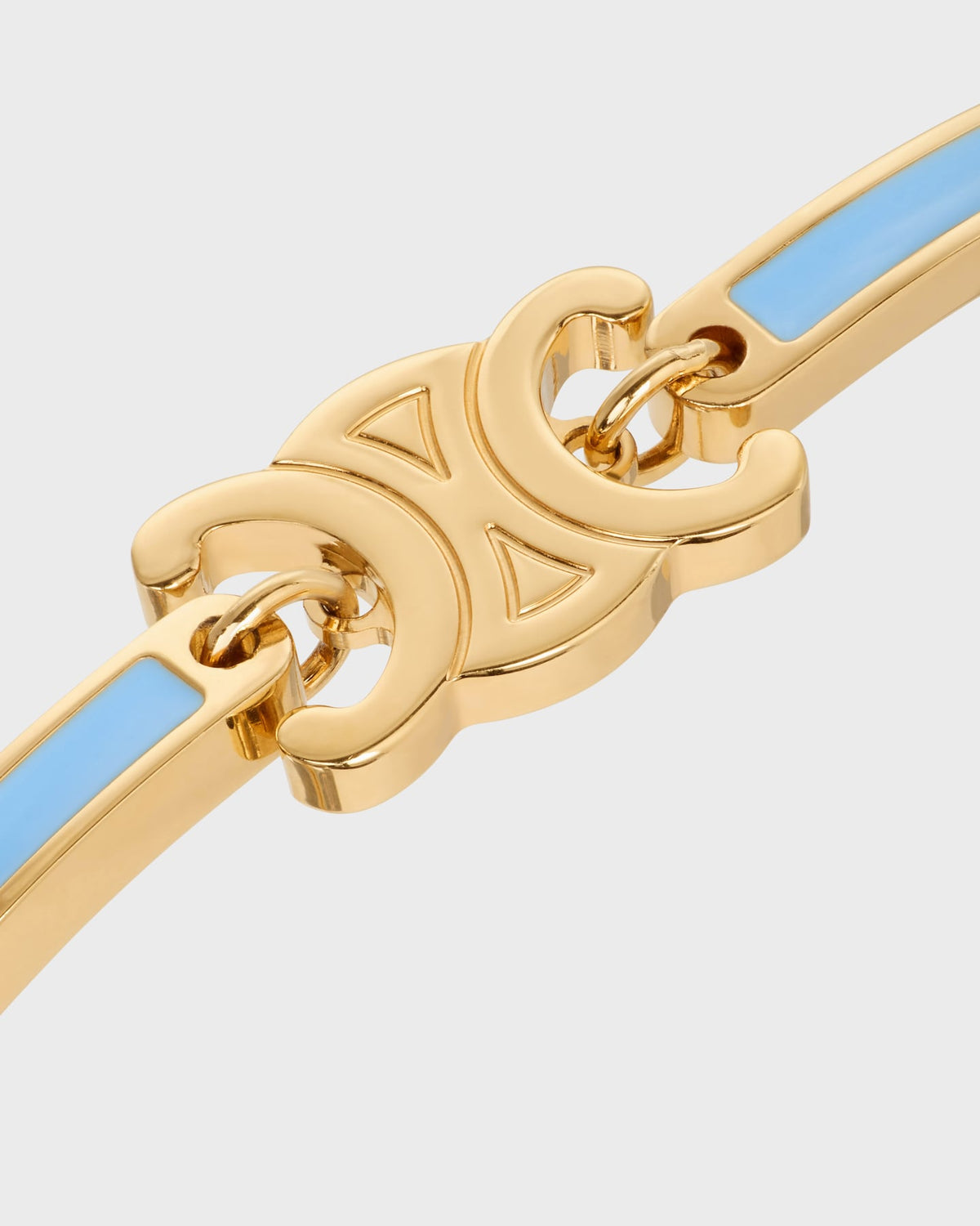 Celine triomphe articulated bracelet in enamel and brass with gold finish