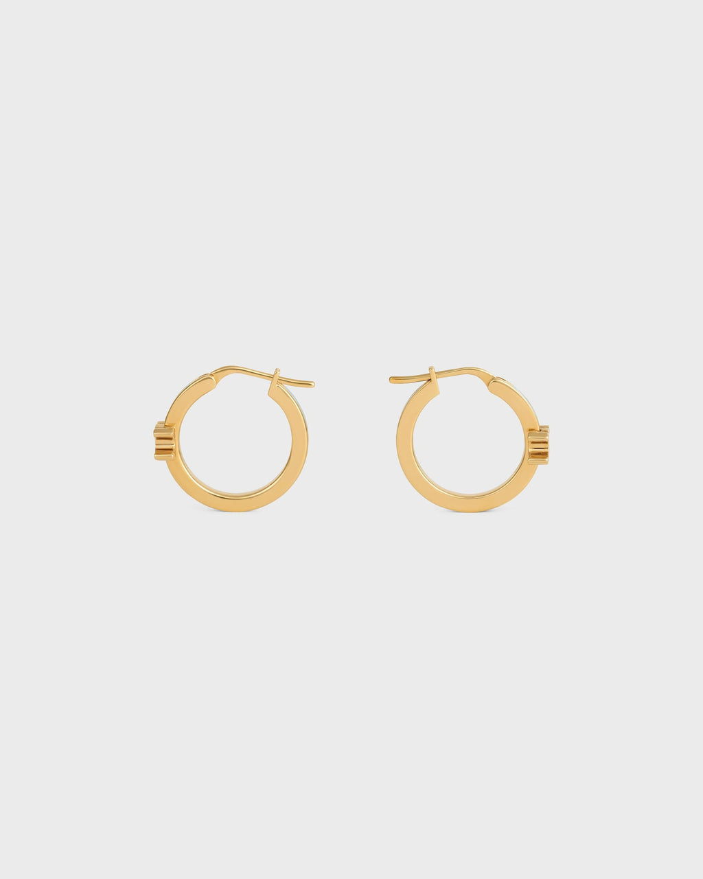 Celine triomphe hoops in enamel and brass with gold finish