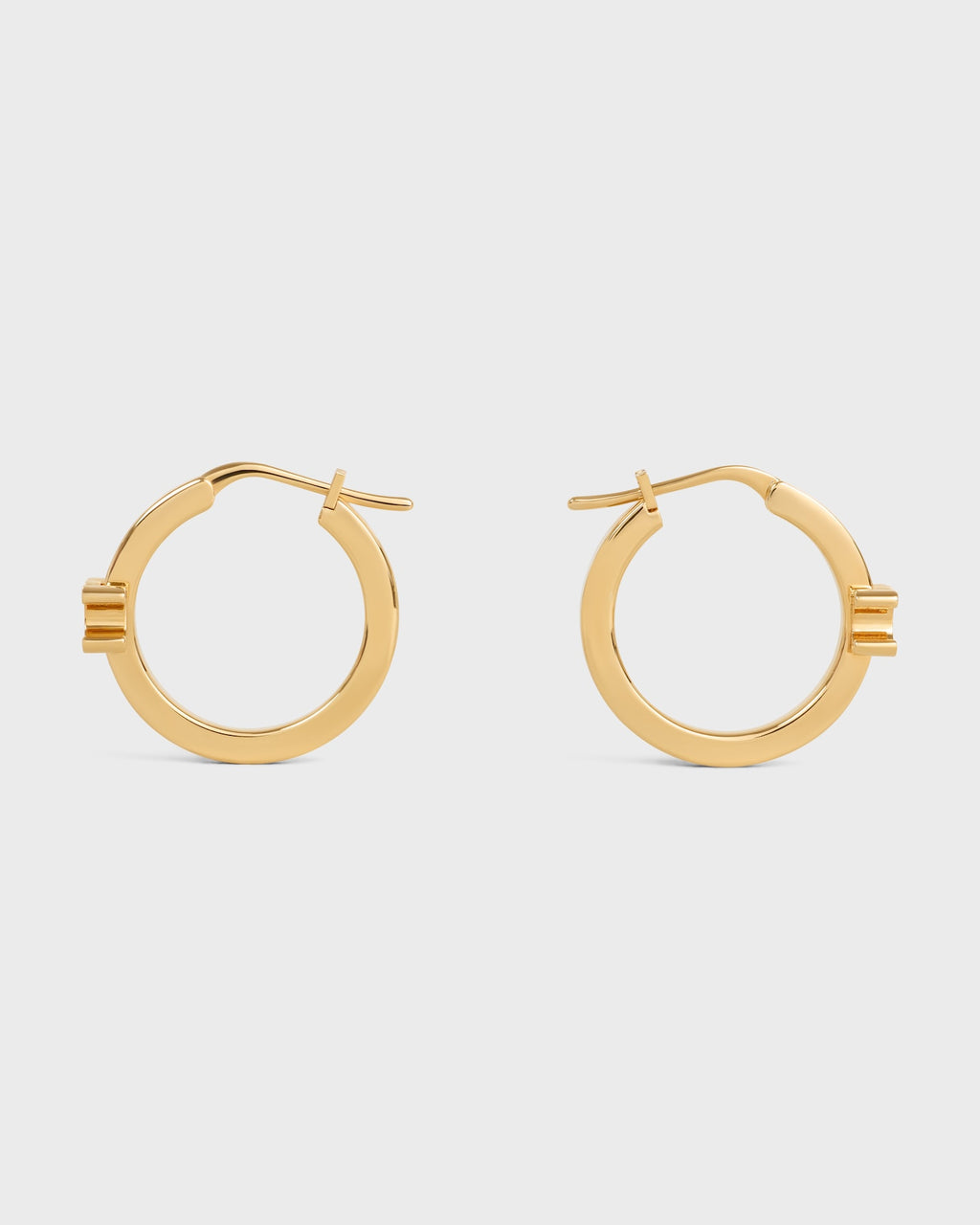 Celine triomphe hoops in enamel and brass with gold finish