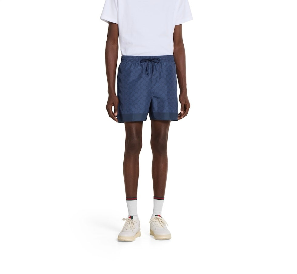 Gucci 833310 XHAKR,Gucci GG printed swim shorts,Gucci blue monogram swim shorts,Gucci blue swim shorts,Gucci swim shorts,Gucc