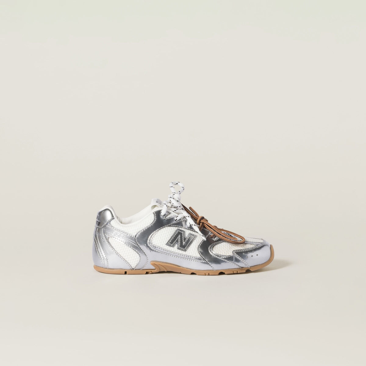 MIU MIU 5E165E,Miu Miu 530SL New Balance metallic sneaker,MIU MIU New Balance silver sneaker,MIU MIU new balance 530sl,New ba